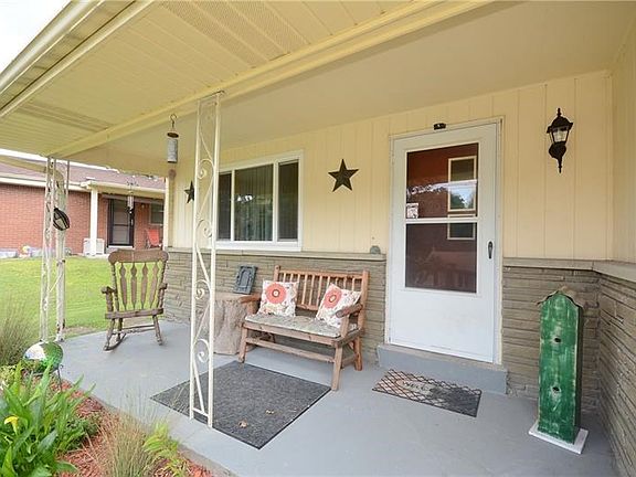No matter the season, this front porch is the perfect place to breathe in some fresh air and enjoy the foliage around your home.