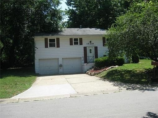 Raised ranch with split entry, 2 car garage.