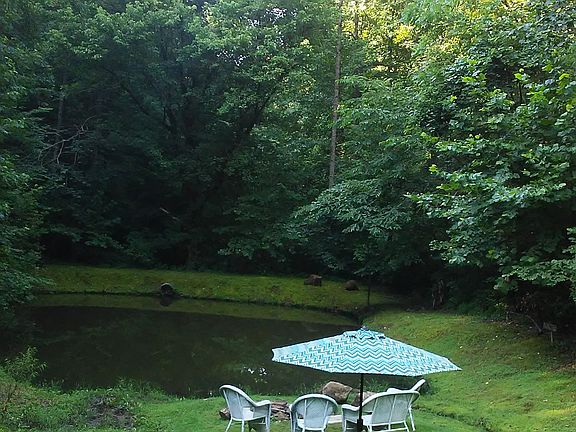 Stocked fishing pond/firepit