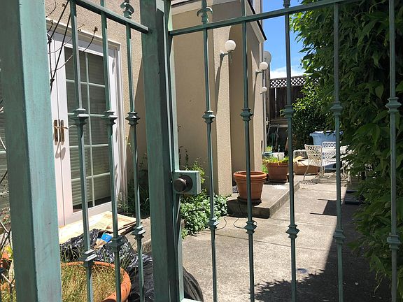 Gated entry into private patio and front door area.