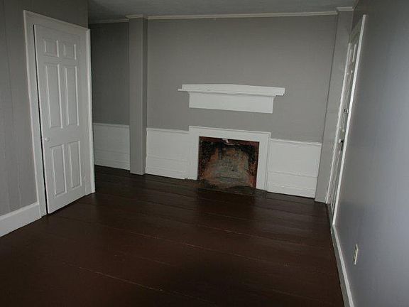 Bedroom with closet. Please note that the fireplace is NOT operational.