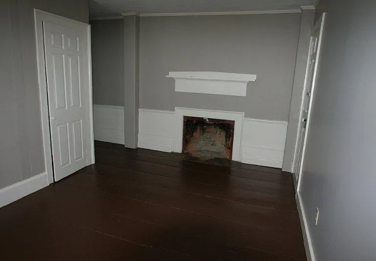 Bedroom with closet. Please note that the fireplace is NOT operational.