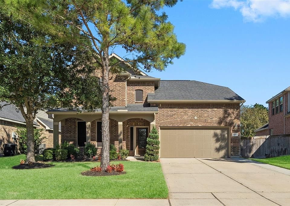 Welcome to 12611 Fisher River Lane, great long driveway for parking