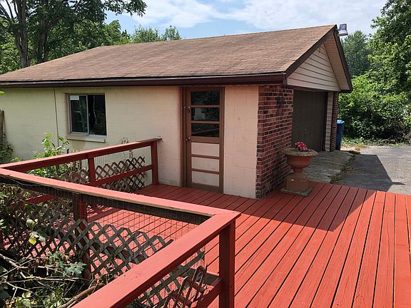 Back patio that leads to detached garage