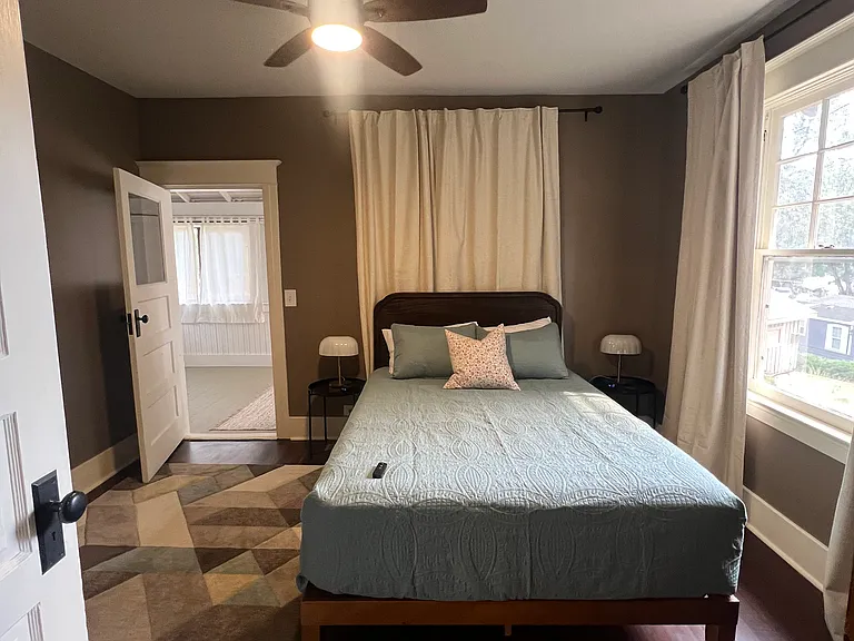 Bedroom 2: Queen bed. The uninsulated sunroom is accessed through this bedroom.