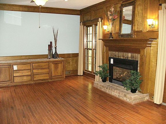 Warm, inviting Family Rm. has french doors to screened porch.