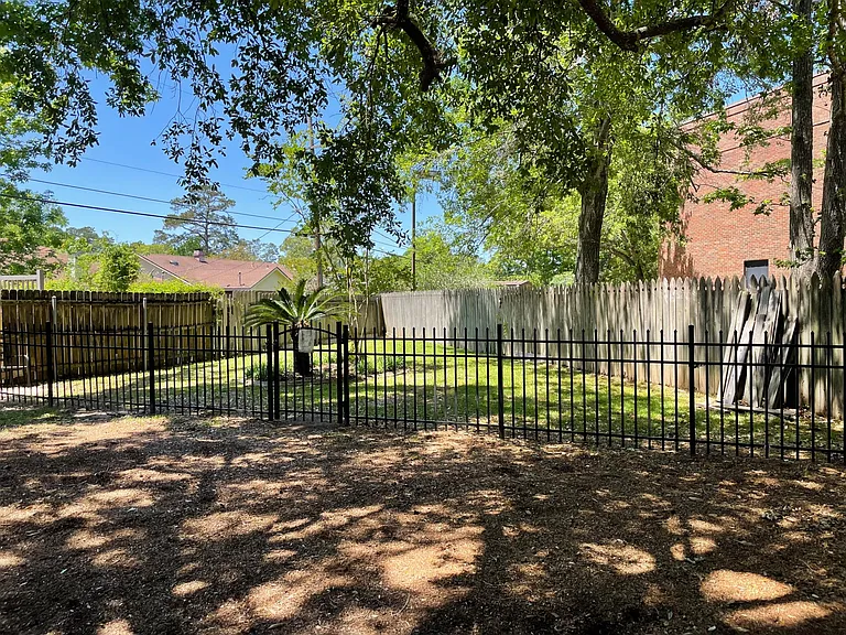 small fenced "dog park" in complex