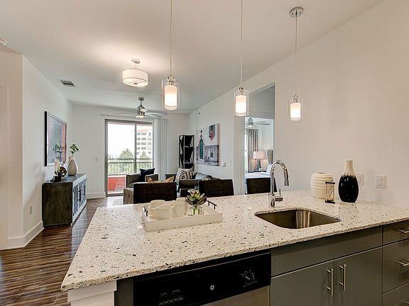 Florence at the Harbor living area and kitchen space with great natural lighting