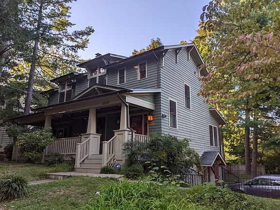 Corner house front door facing south on Curtis Road. East side driveway opens onto Oakridge Avenue.