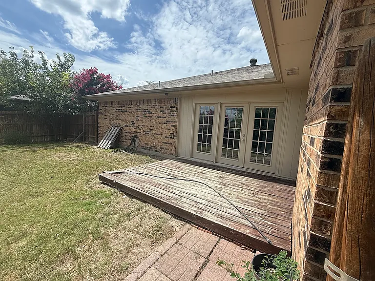 Wooden deck in backyard.