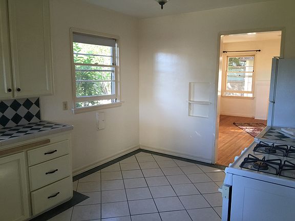 To the right of the kitchen window is where the dining table sets in the corner over there. Can it up to a 47' round table.