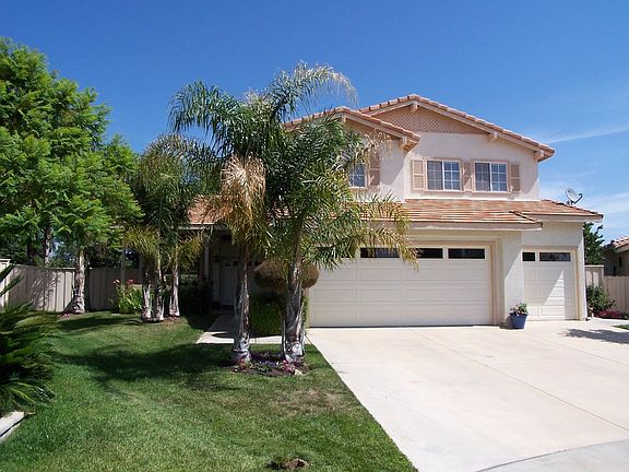 FRONT OF HOME WITH 3 CAR GARAGE. ON QUIET CUL DE SAC.