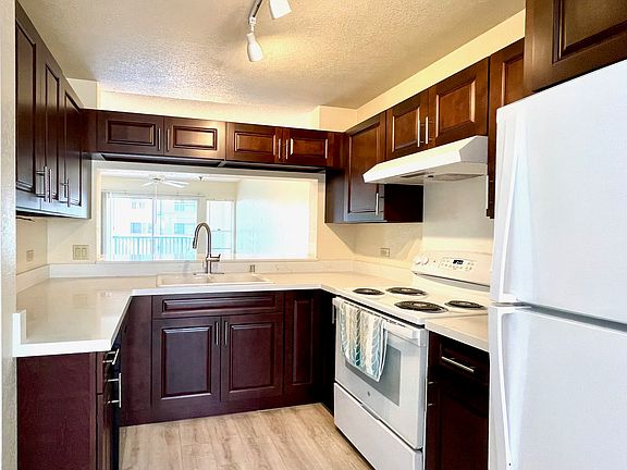 Newly updated kitchen cabinets counters and new stove.