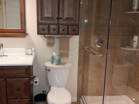 Bathroom with door access from hallway and 