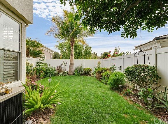 Back yard of the home.  No one behind.