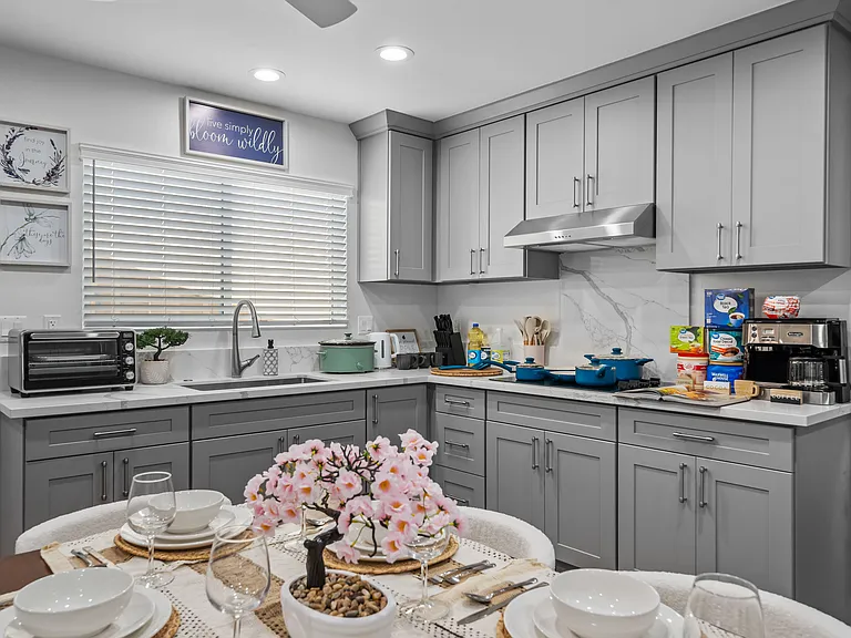 Enjoy your meals at the cozy dining space with easy access to kitchen appliances and essentials.