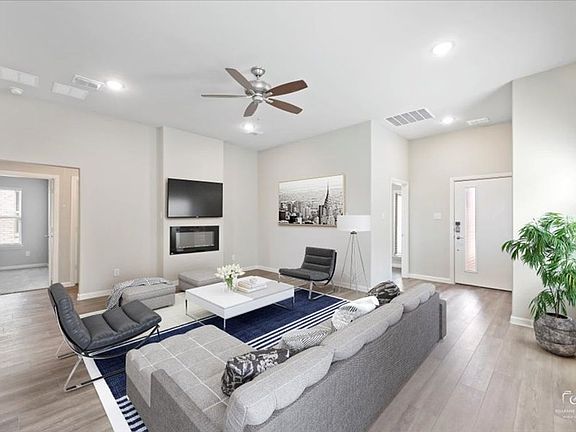 Living Room in the Amber home plan by Trophy Signature Homes - REPRESENTATIVE PHOTO