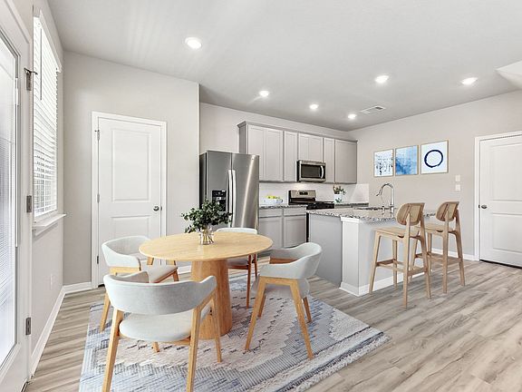 Enjoy a meal in this beautiful dining room.