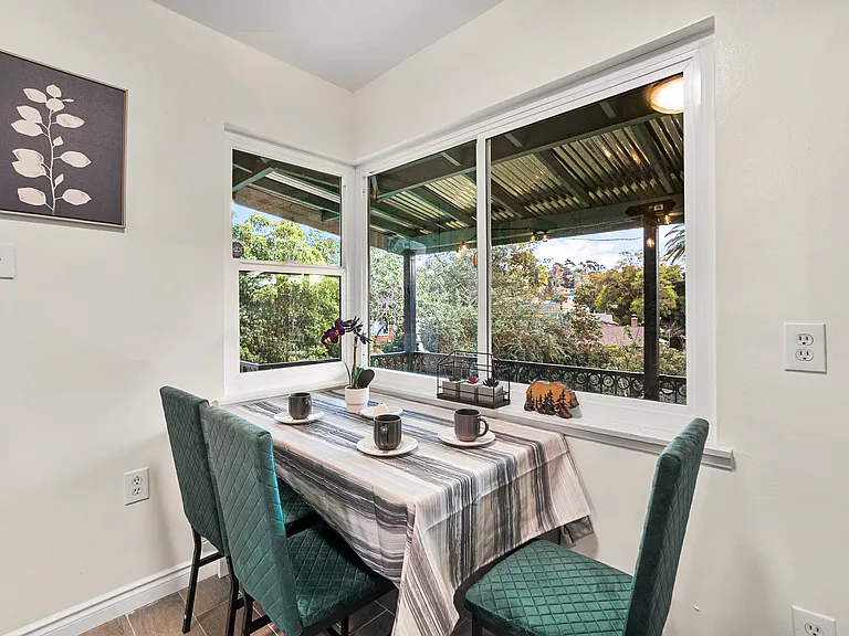Savor your dining experience by the window, with a balcony breeze.