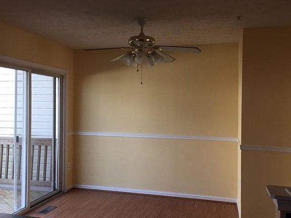 Eat in kitchen with ceiling fan and sliders to deck