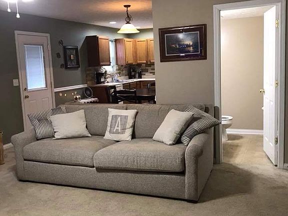 Living room with kitchen behind