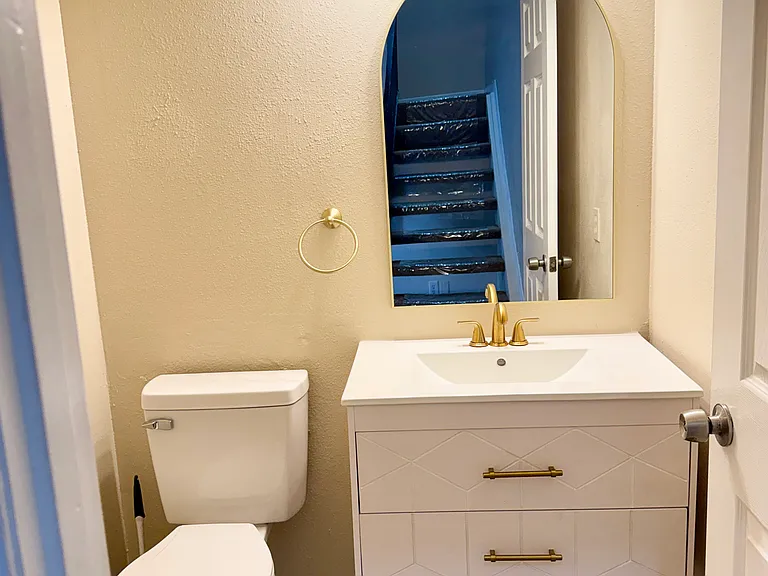 New designer vanity and new toilet in powder 1/2 bath downstairs