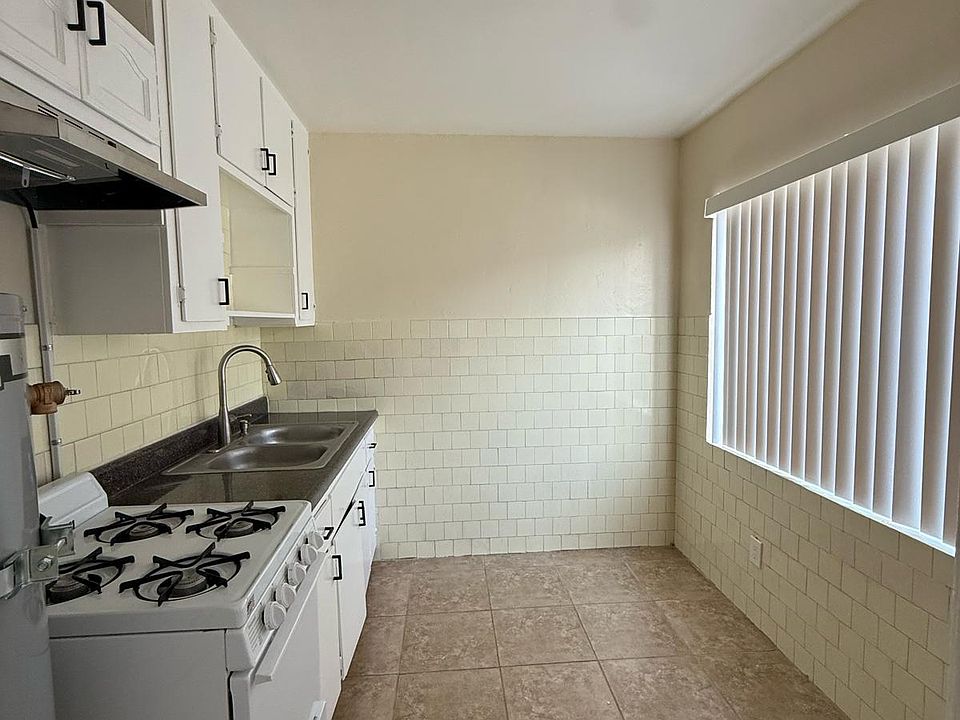 Kitchen with granite counter and range