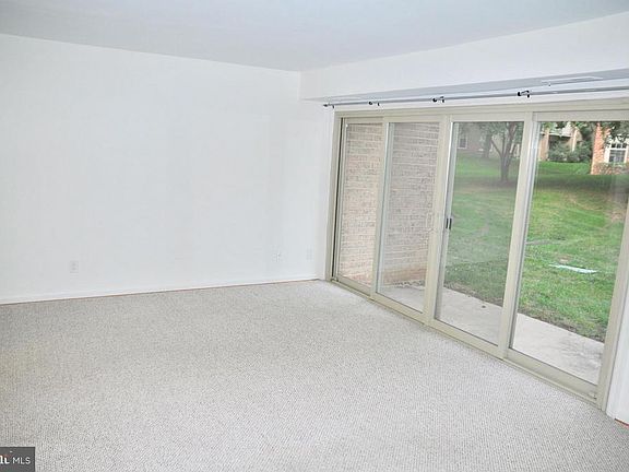 Living room -- Double sliding glass doors to patio space.