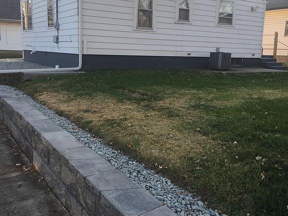 Yard view and side wall along the house. Included in the rent will be the mowing. We will provide that. No snow removal, though.