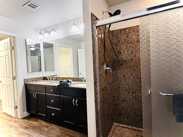 3rd Floor Master Bath has dual sinks, makeup mirror w/ magnification, shower, walk-in closet & more.