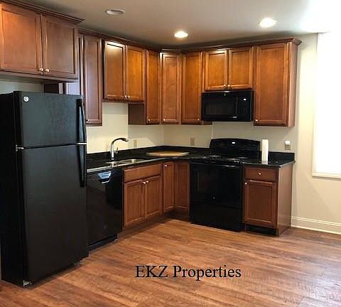Brand new kitchen with granite countertops.