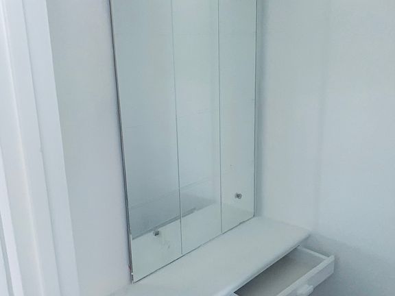 Front foyer closet with built in drawers