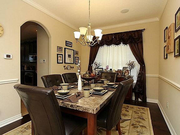 Formal Dining Room *Chair Railing*Crown Molding*Oak Wood Floors* Upgraded Light Fixture.