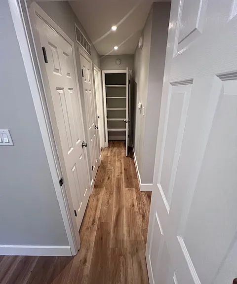Hall way with 2 closets and Forced Air Heating