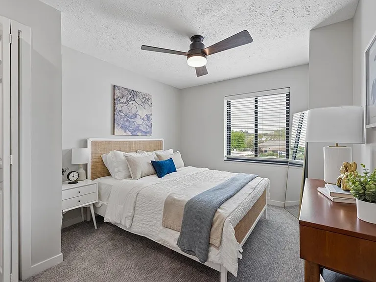 A serene retreat with soft natural light, refined finishes, and a cozy atmosphere designed for restful living.
