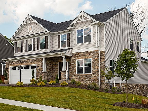 Exterior front view of the S A Homes Dartmouth C plan - 2 story Craftsman style design with covered