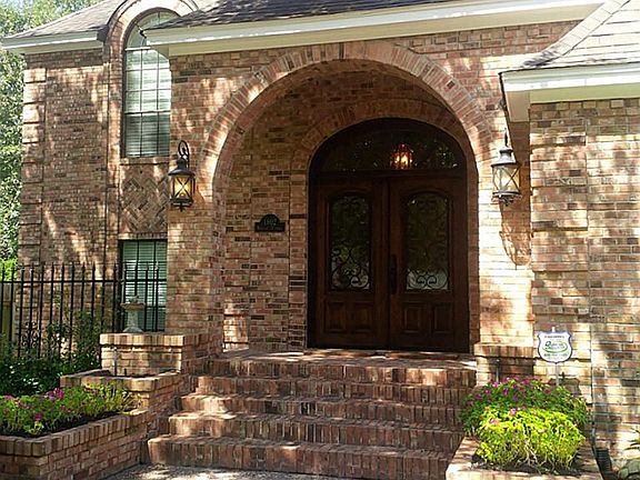 Welcome home! Exquisite double lead glass front doors and beautiful architectural features complete the fantastic curb appeal!