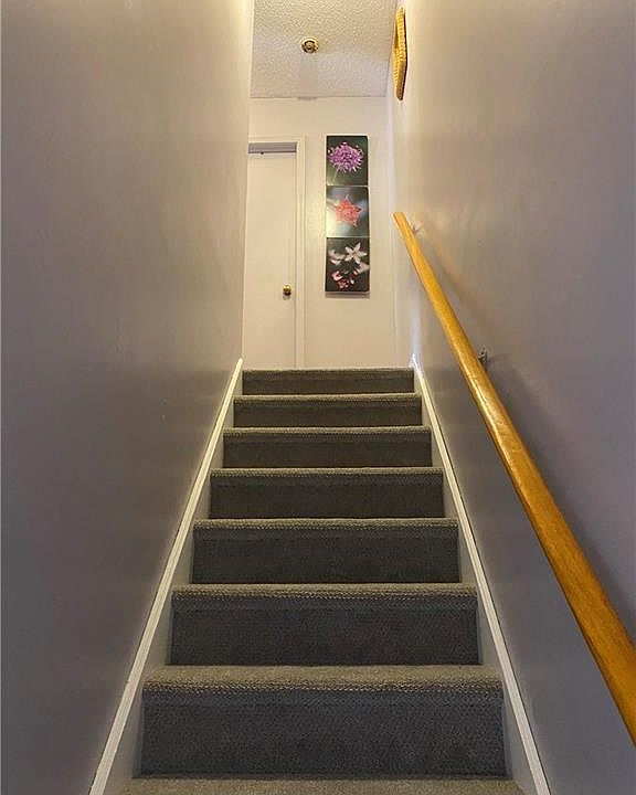 Stairs to bedrooms and bathroom