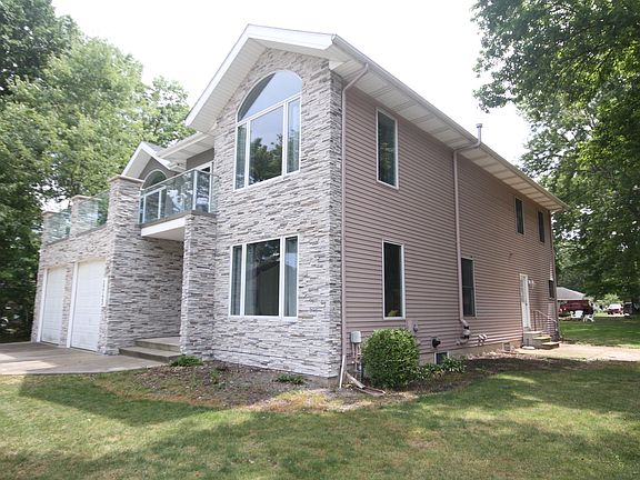 4,000+ SF of living space not including the huge finished basement. Side door from kitchen allows easy access to side yard stamped concrete patio and back yard.