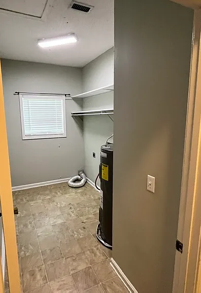 Laundry room with attic access