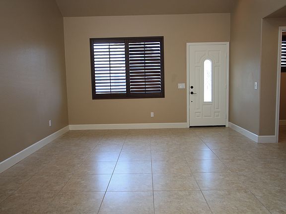 Entry with adjacent half bath for guests, as well as a spacious closet (not in photo)
