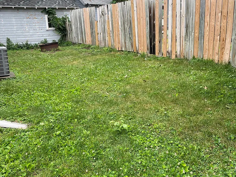 Fenced-in back yard.