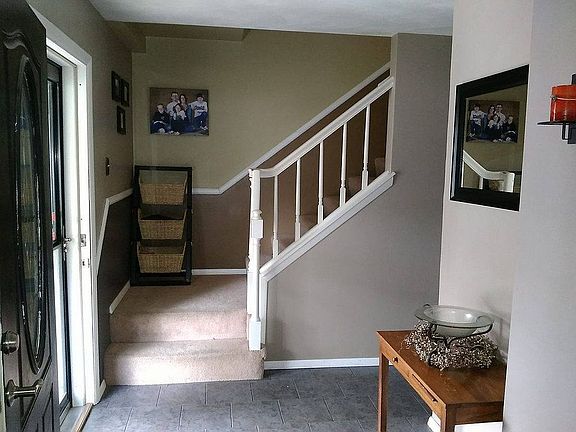 Entry with wide staircase-