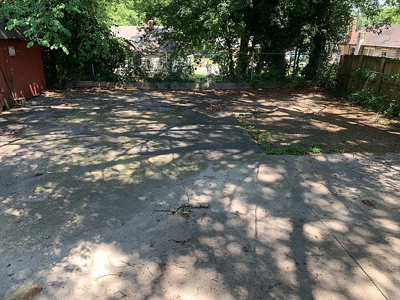 Concrete pad in back for additional parking