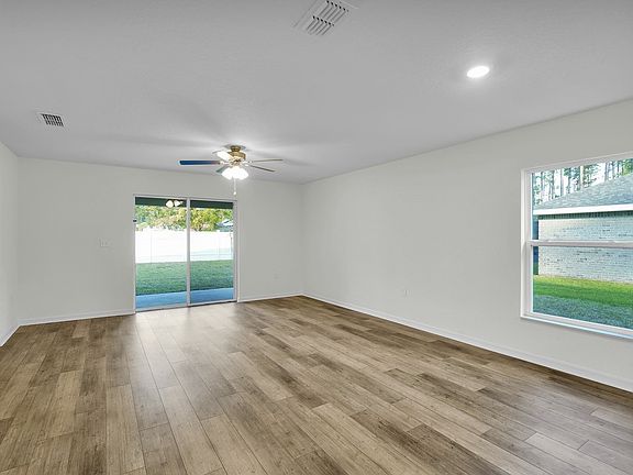 The family room has sliding glass doors that lead to the back patio