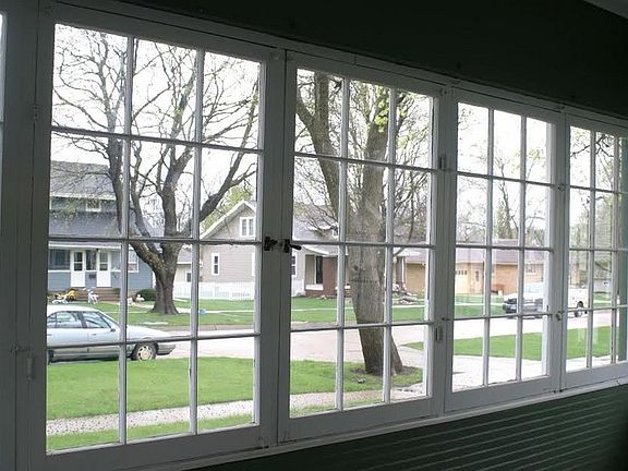One of the three sides of the porch
						:
						Begin & end your day in luxury. Hinged windows open to enjoy the neighborhood.