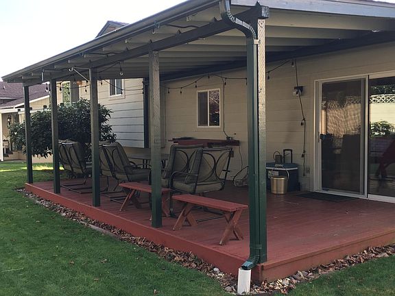 Covered deck in back close to kitchen.