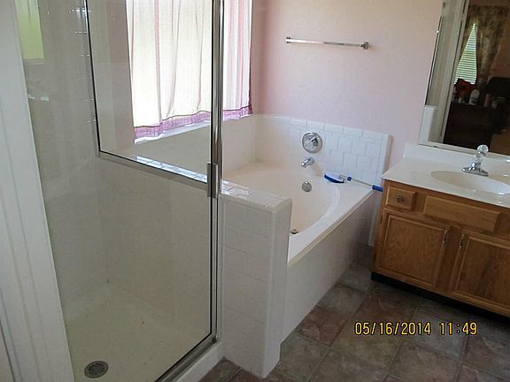 Master Bathroom with double sink and Garden Tub and separate Shower