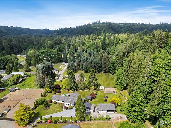 The large tree line to the right is a wildlife buffer and the surrounding properties are all large lots, allowing for maximum peace & privacy>