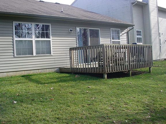 Wood deck in back is perfect for entertaining or just relaxing with a cup of coffee! 